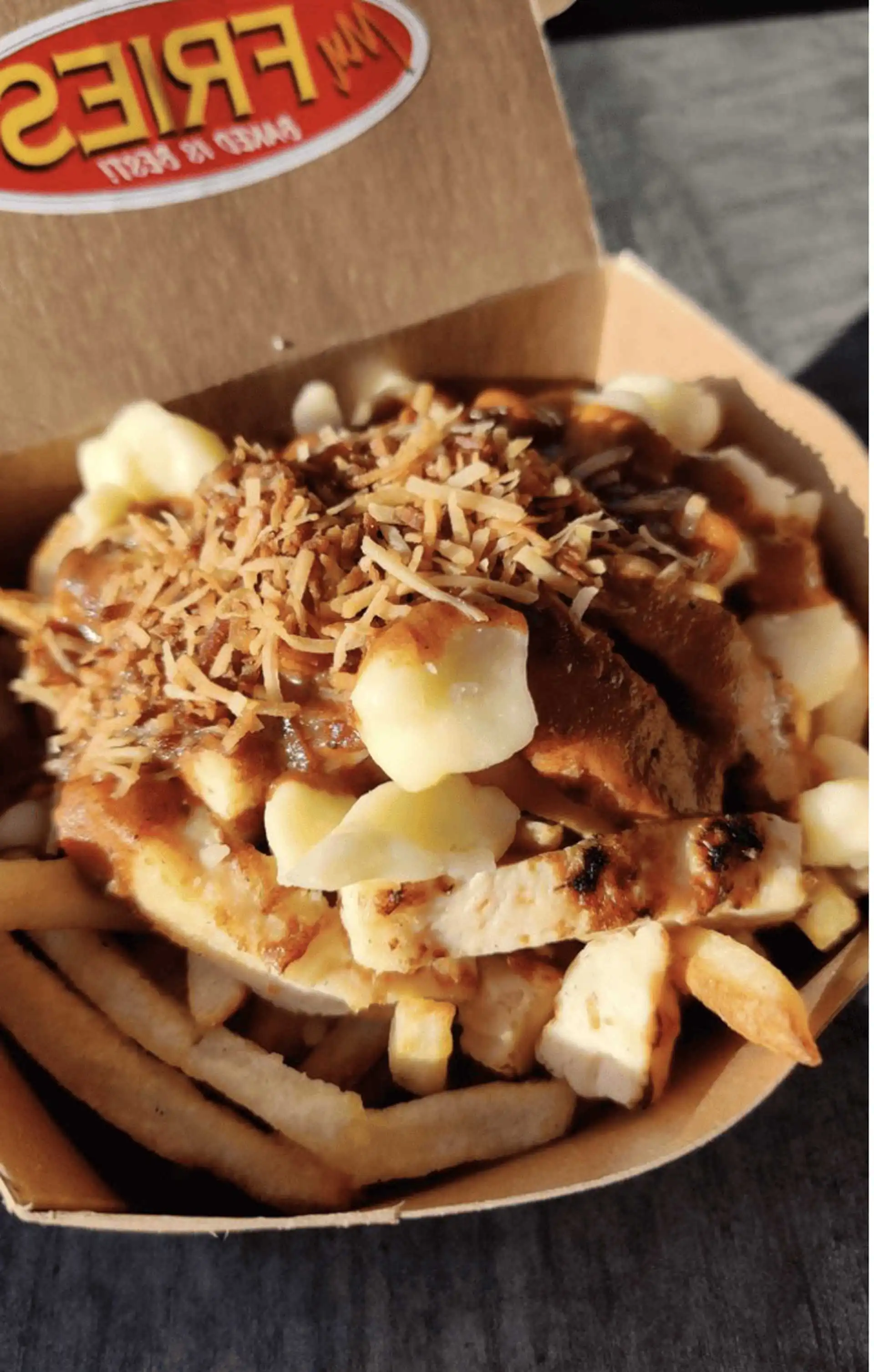 Delicious Butter Chicken Poutine in Edmonton, AB